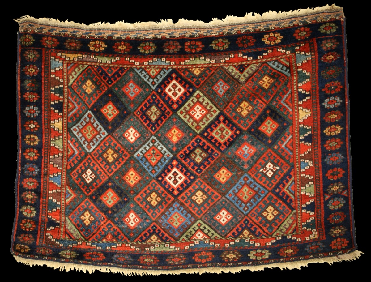 A 19th-century Jaf Kurdish weaving — the classic diamond lattice